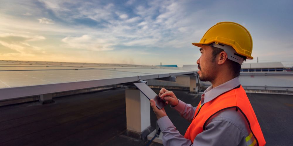 A man checking solar panel