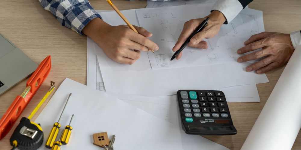 Papers on the table with tools and calculator