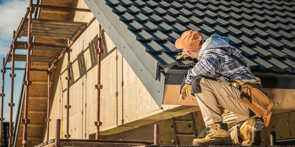 A man checking the roof
