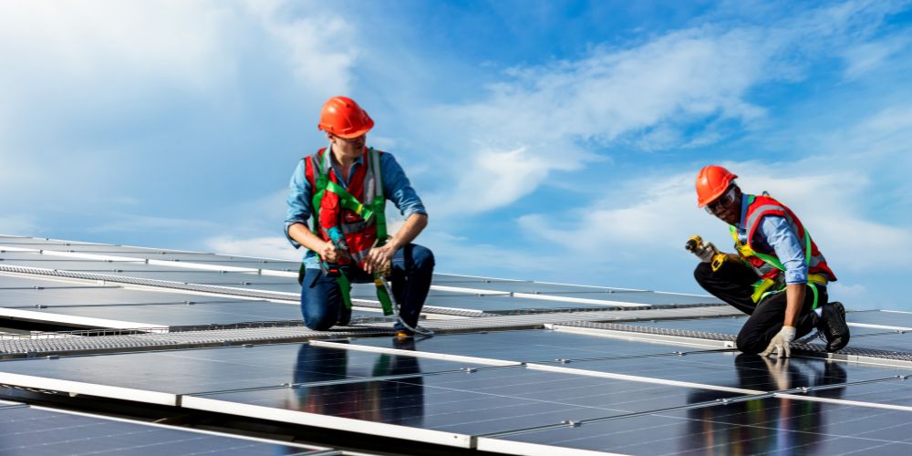two man installing a solar panel